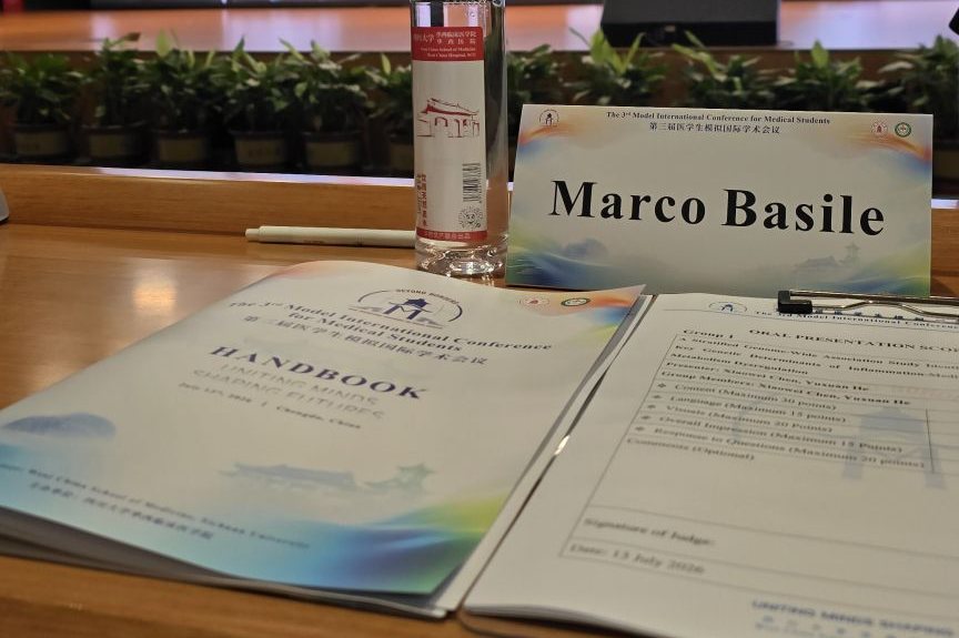Name card, conference handbook and oral presentation score sheet